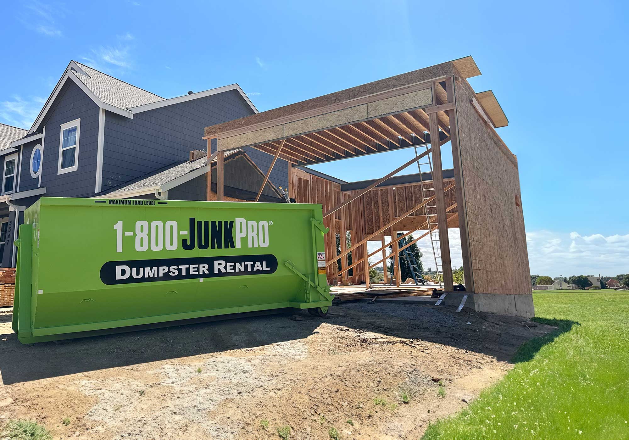 1-800-JunkPro Dumpster at a construction site