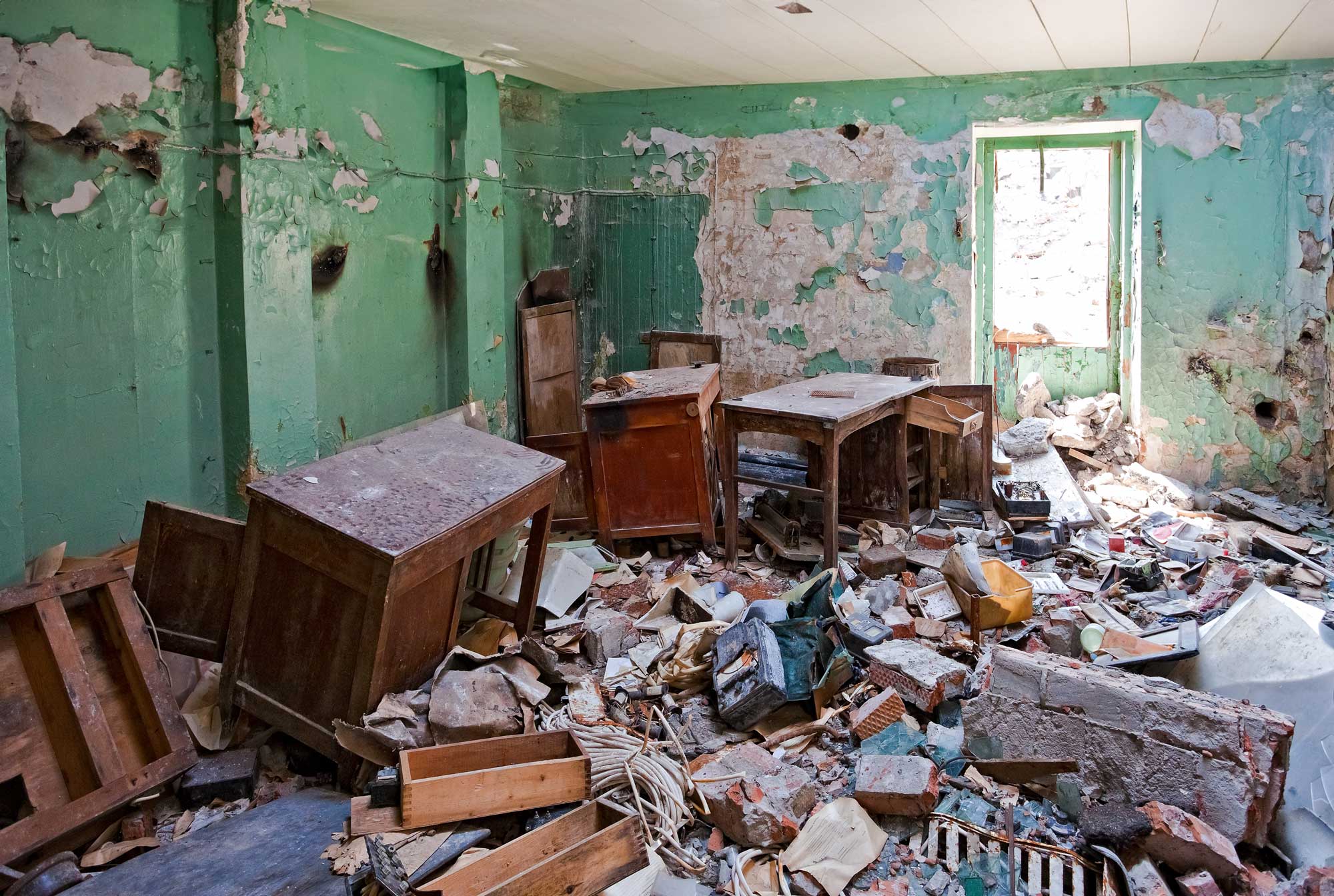 A home ruined from flood damage full of debris