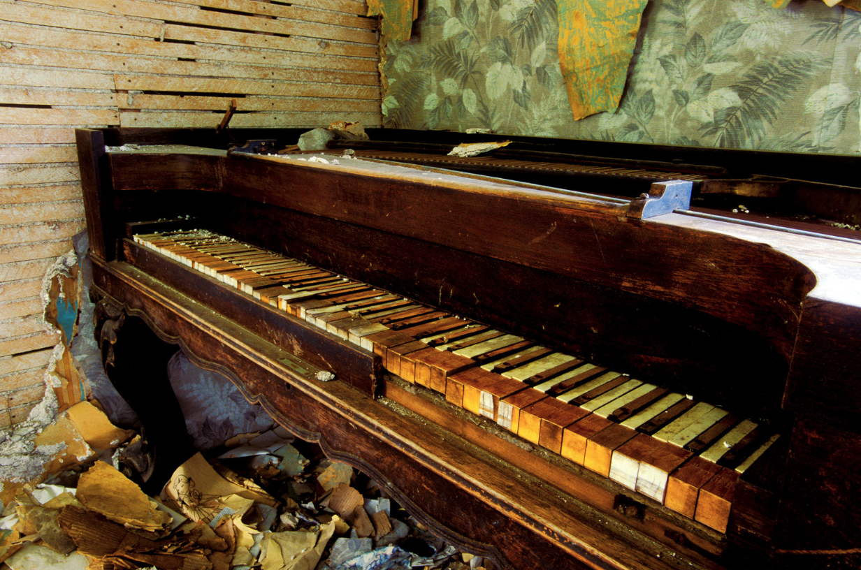An old Piano damaged beyond repair, ready for disposal
